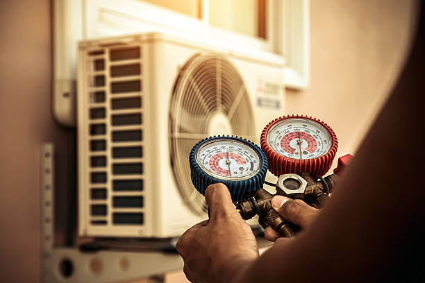 Professional Air Conditioning Service technician working in Upper Falls, MD